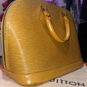 Authentic Louis Vuitton Alma Ebi marigold yellow